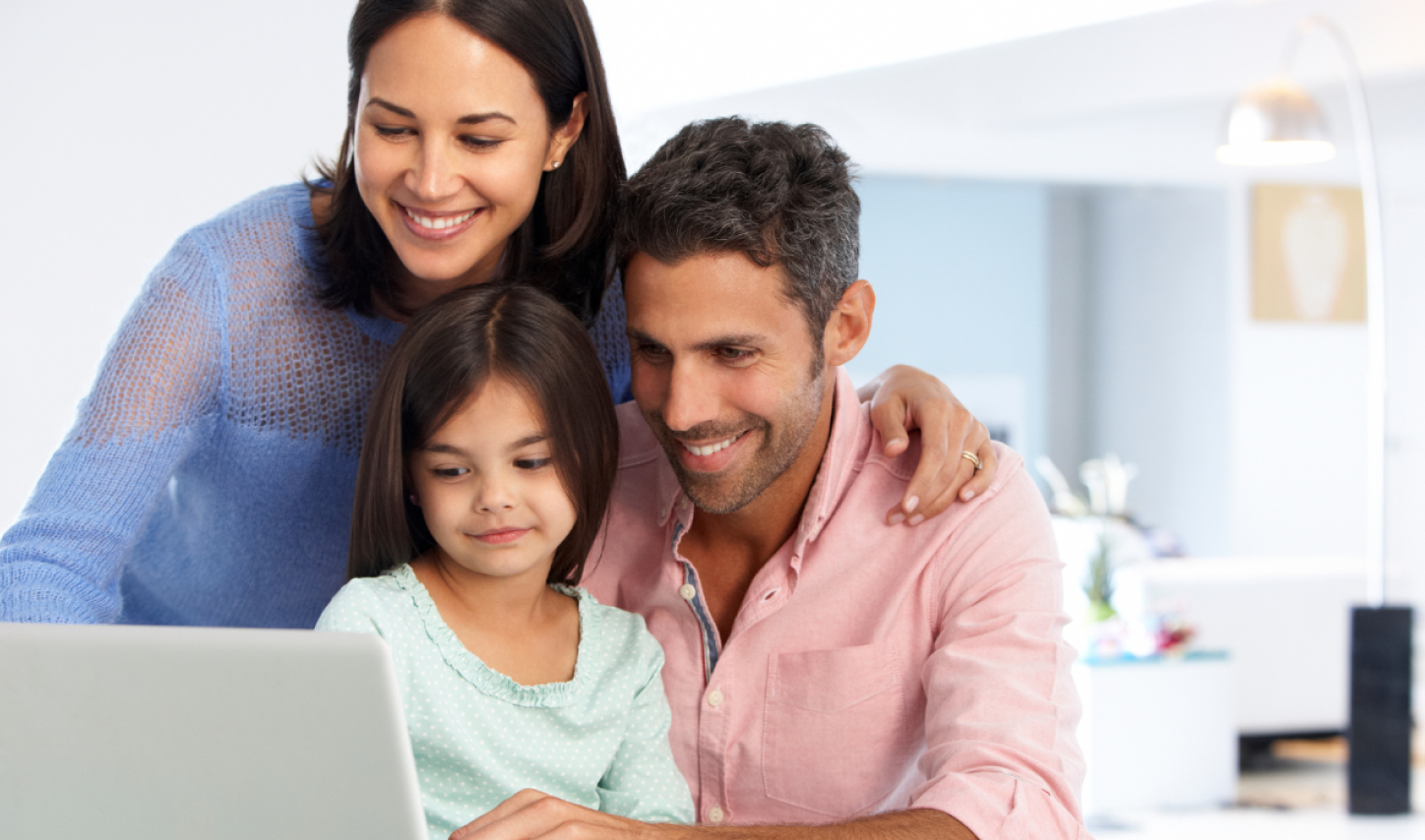 Family looking at computer